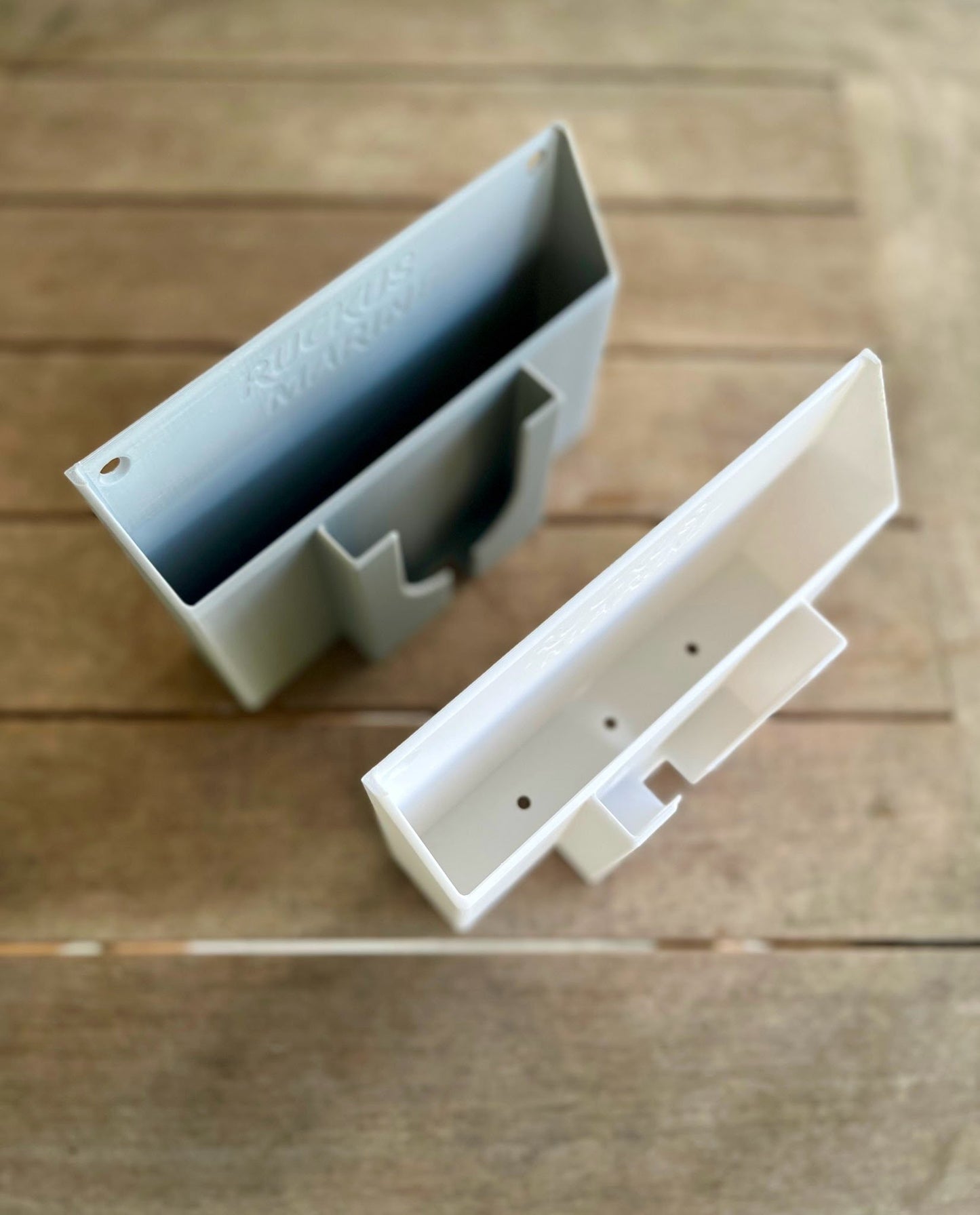 Ruckus Marine Console Caddy in gray and white PETG, showing color options that blend with skiff interiors and streamlined minimalist design