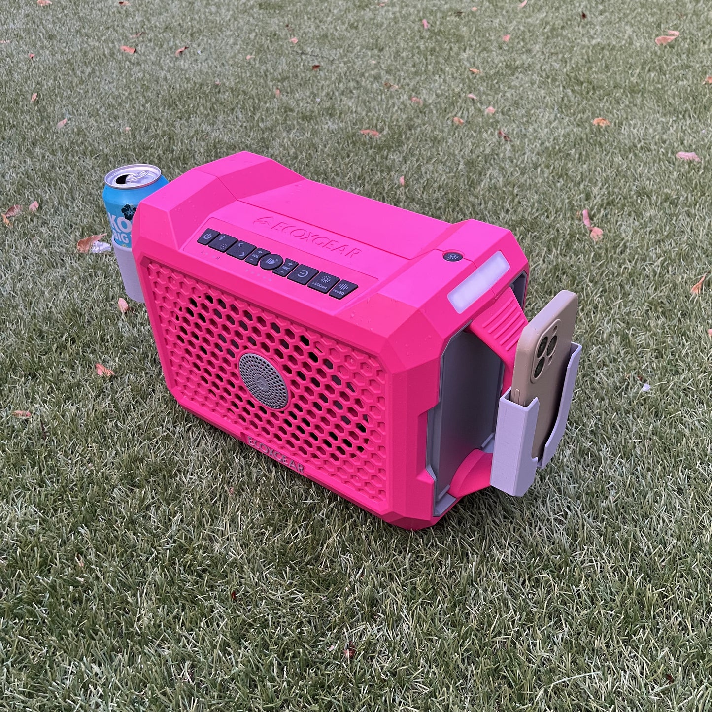 ECOXGEAR Defender speaker in pink, shown with Ruckus Marine phone holder and cup holder installed on side handles