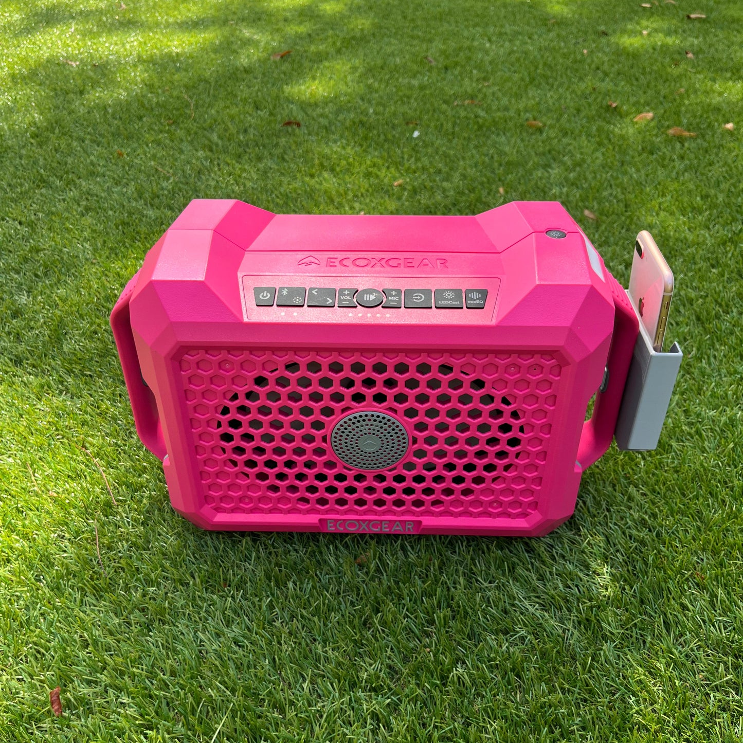 Ruckus Marine clip-on phone holder for the ECOXGEAR Defender speaker, shown in gray on a pink speaker