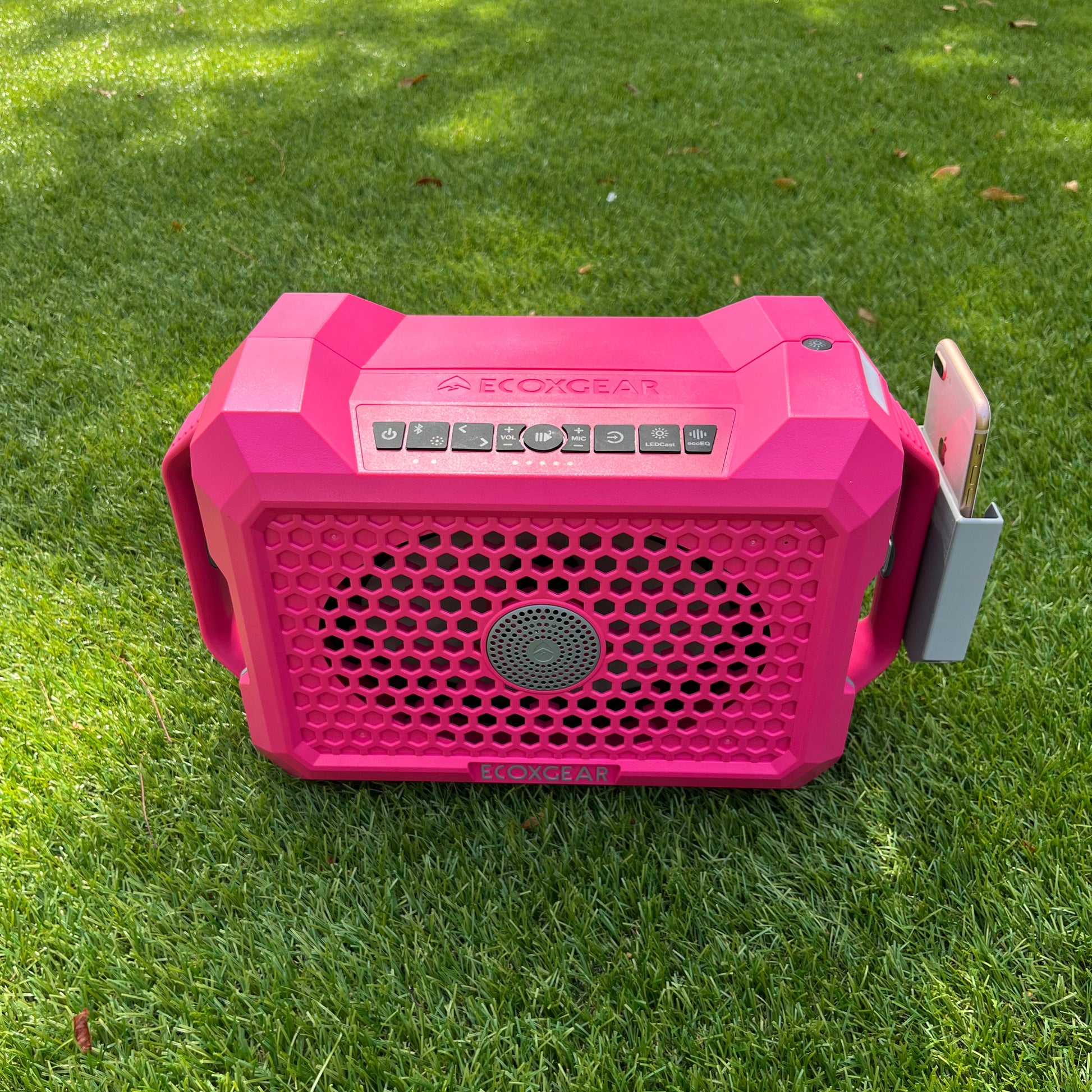 Ruckus Marine clip-on phone holder for the ECOXGEAR Defender speaker, shown in gray on a pink speaker