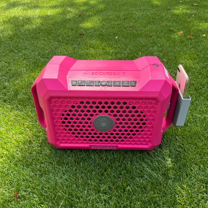 Ruckus Marine clip-on phone holder for the ECOXGEAR Defender speaker, shown in gray on a pink speaker