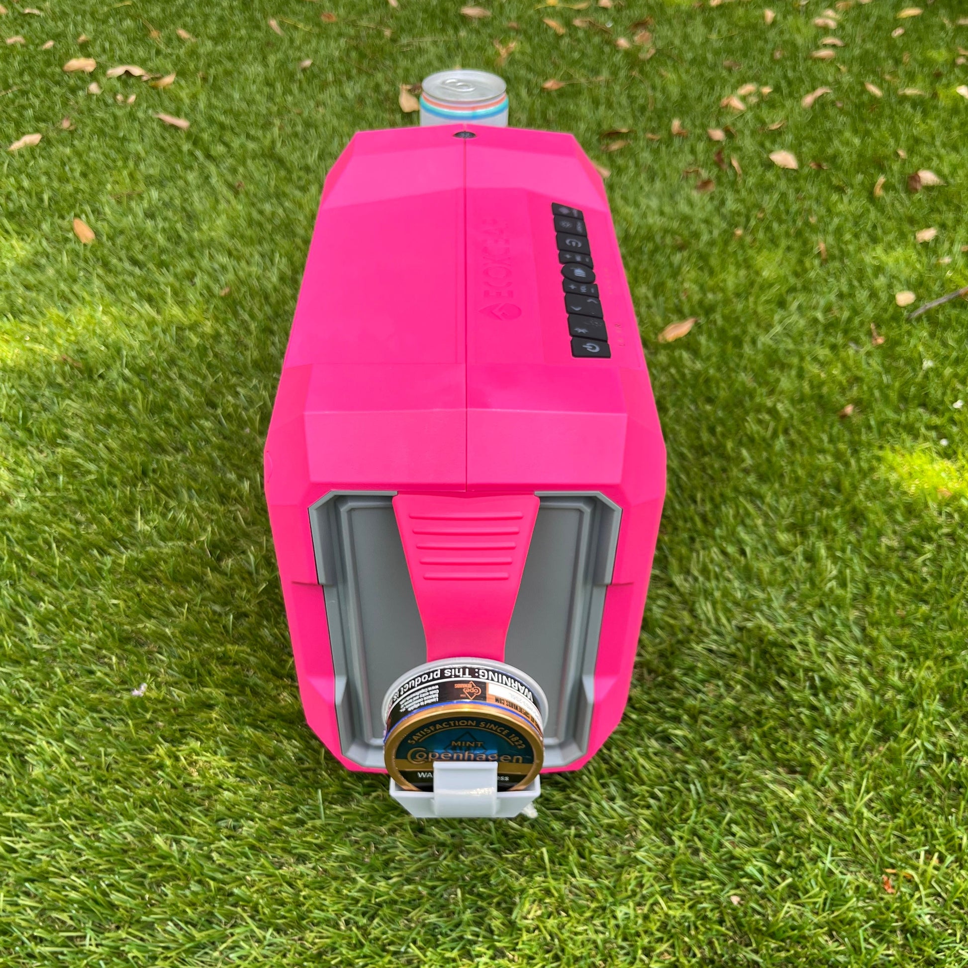 Ruckus Marine attachment for ECOXGEAR Defender Speaker. Zyn and dip can holder installed on side handle of pink Defender speaker