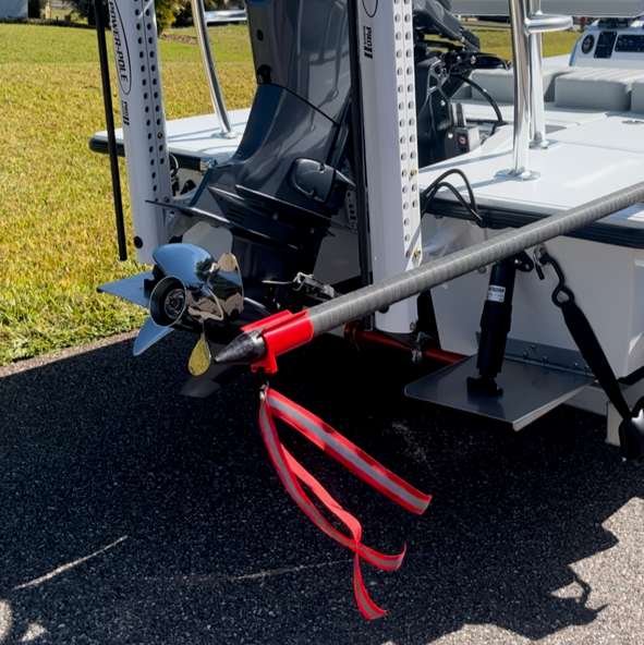 Push pole safety flag installed on skiff for safe trailering