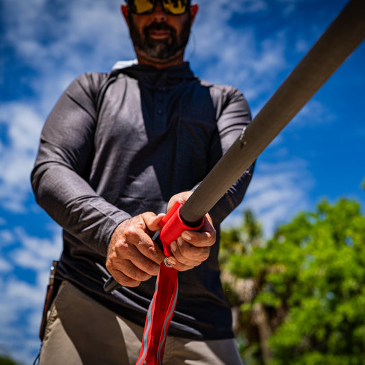 Push pole safety flag from Ruckus Marine being installed on a Carbon Marine push pole