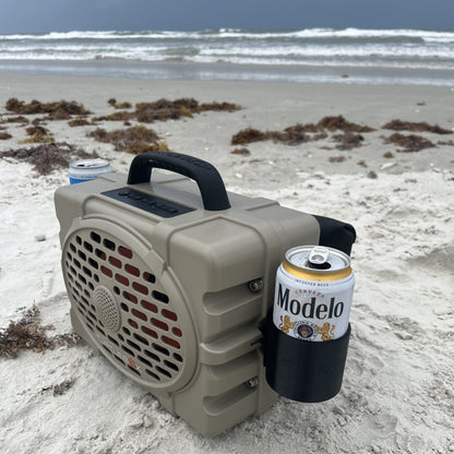 Turtlebox speaker accessory drink holder from Ruckus Marine on the beach shown in black