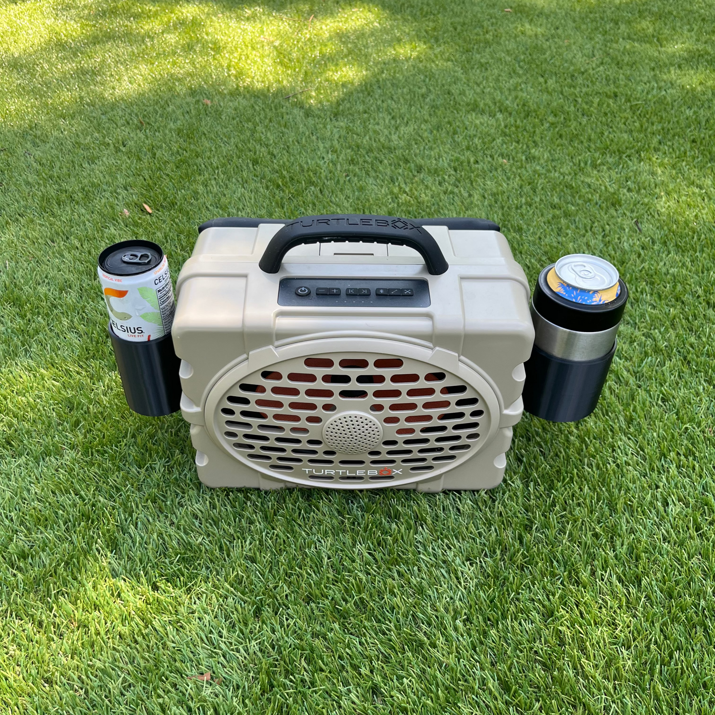 Slim Can Holder and Yeti Colster Holder for Turtlebox Speaker shown on a tan Gen 3 Turtlebox