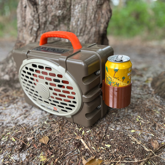 Ruckus Marine Turtlebox Can Holder Attachment shown in brown in the woods