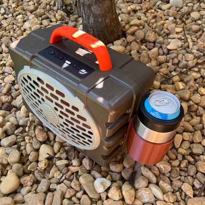 Yeti Colster Holder for Turtlebox Gen 3 Speaker shown in brown on a bed of rocks