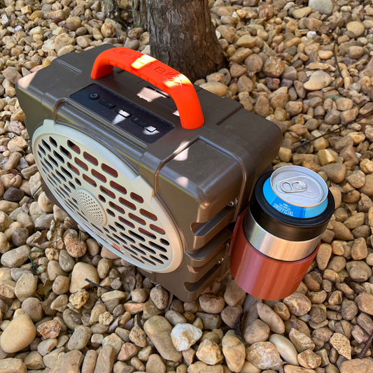 Yeti Colster Holder for Turtlebox Gen 3 Speaker shown in brown on a bed of rocks