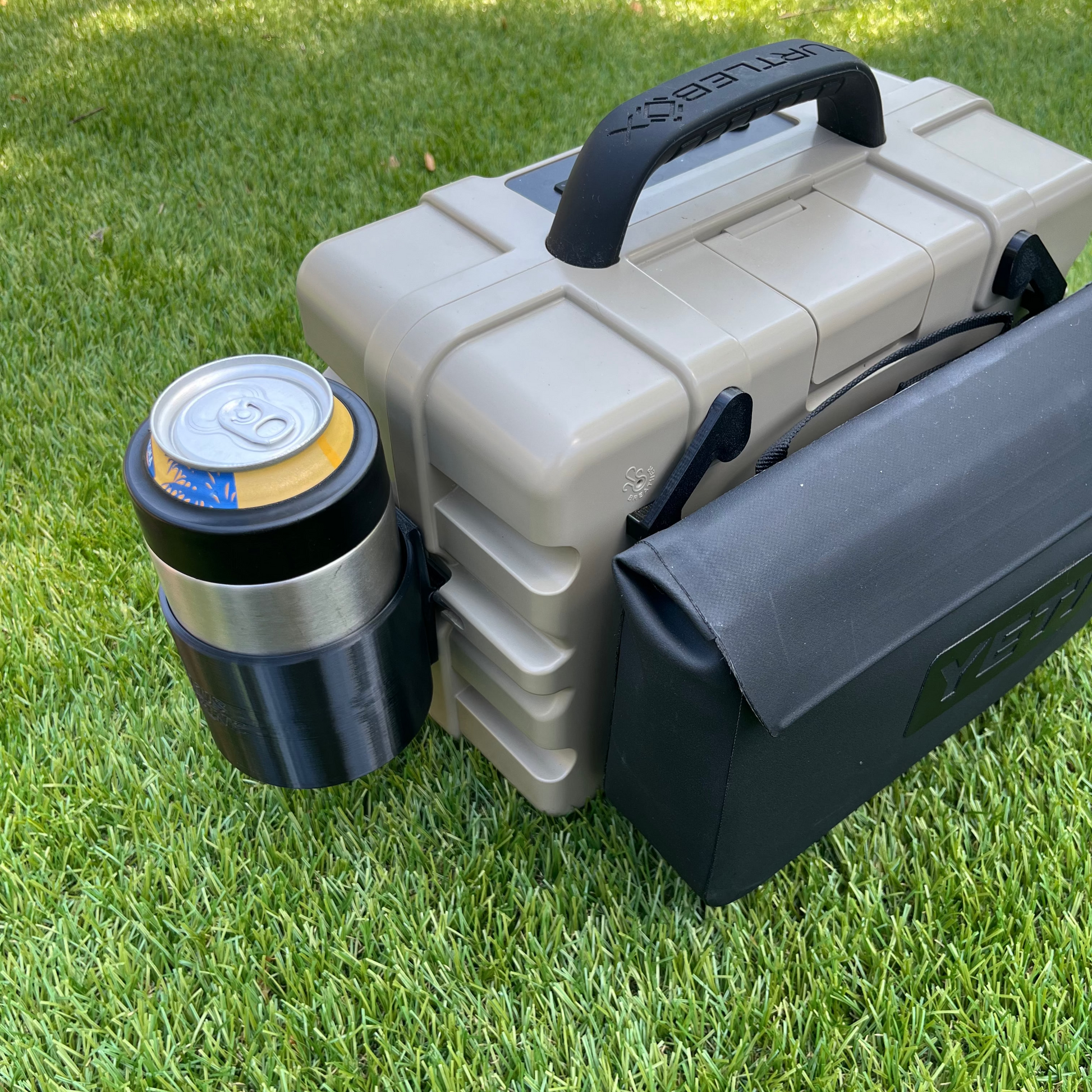 Yeti Sidekick attachment and Yeti Colster attachments for Turtlebox speaker shown in black.